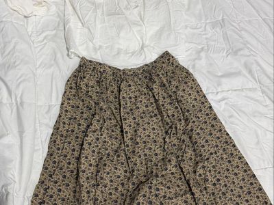 Khaki Pioneer skirt with matching bonnet, white blouse, and color coordinated apron.