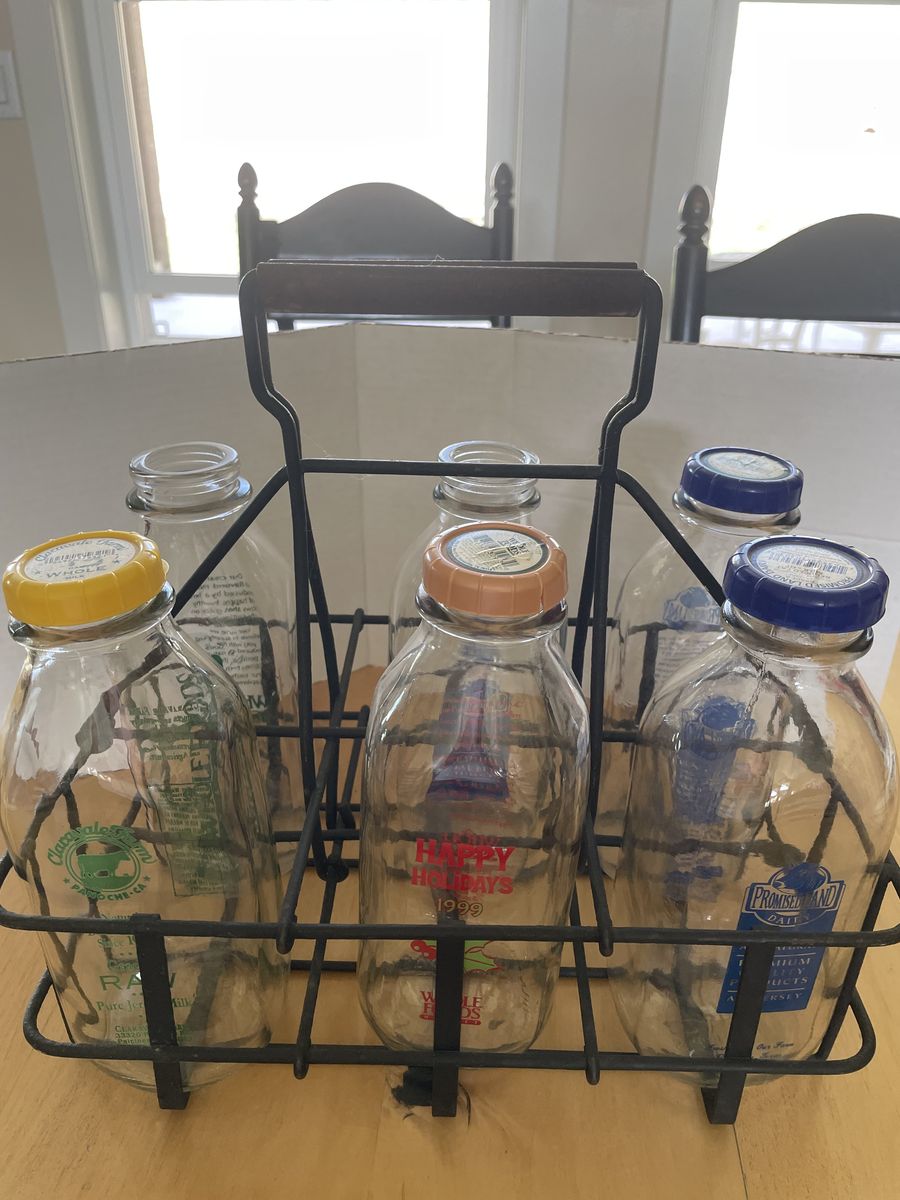 Vintage Metal Milk Bottle Crate with Six Assorted Glass Milk Bottles