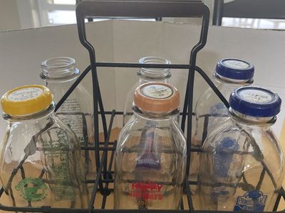 Vintage Metal Milk Bottle Crate with Six Assorted Glass Milk Bottles