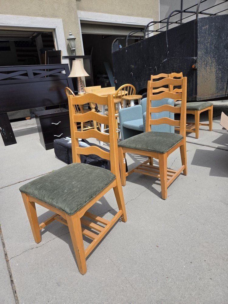 6 wood and green chairs