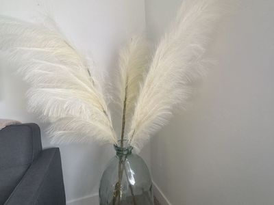 Glass floor vase with faux pampass grass