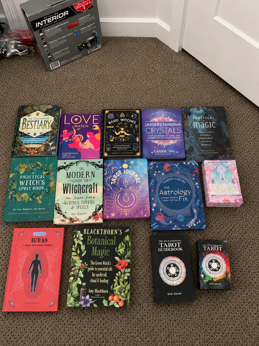 11 astrology/witchcraft books 3 tarot decks.