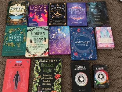 11 astrology/witchcraft books 3 tarot decks.