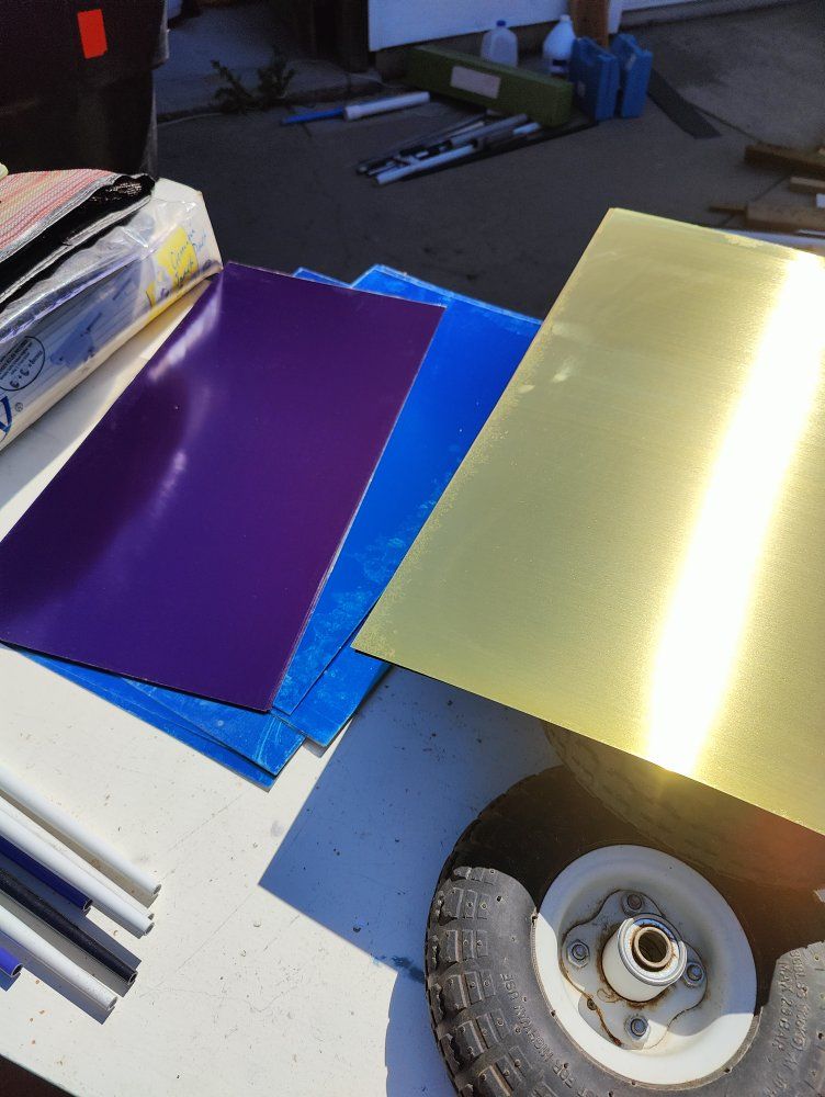 Engraving stock, 12 inches by 24 inches, (1 foot by 2 feet), pieces of brass plated steel sheet metal, with engravable coloring.