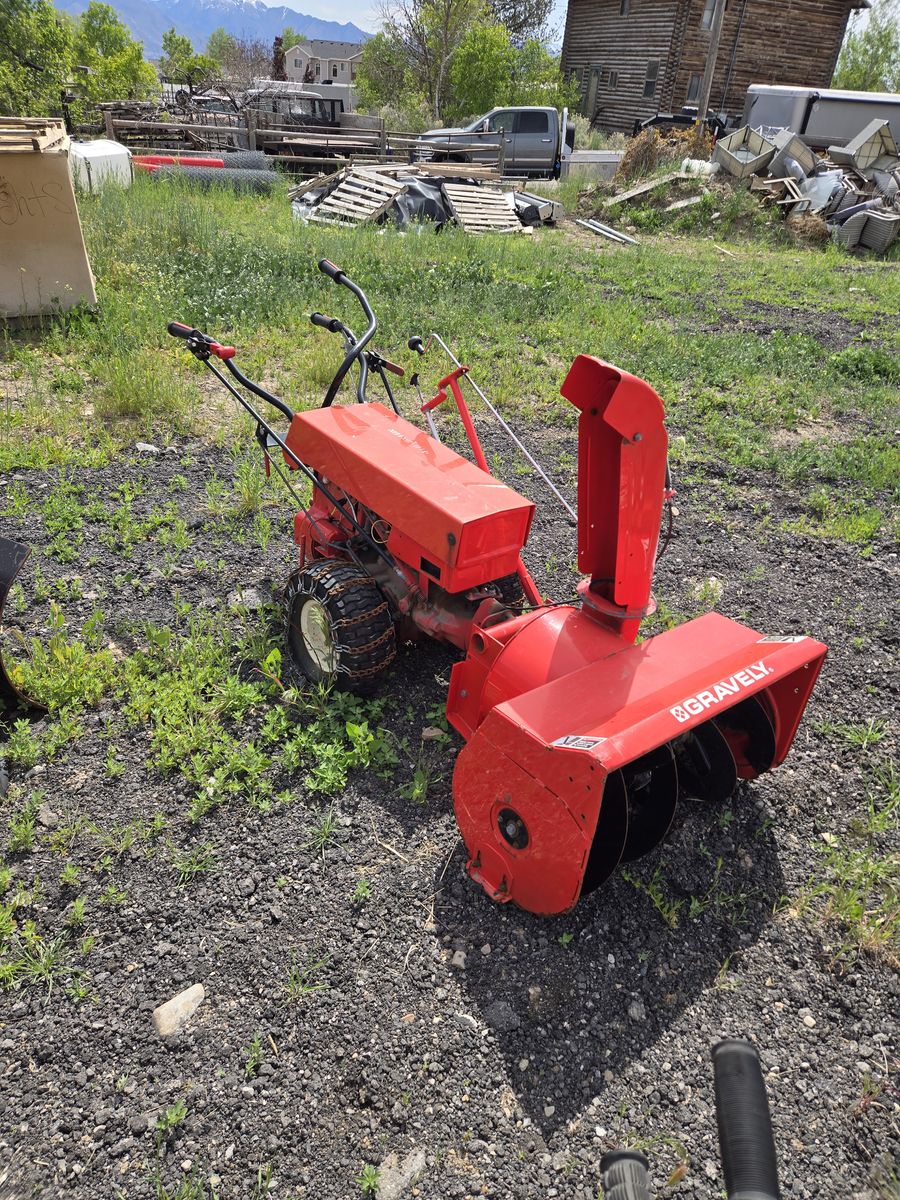 1 Gravely Professional 12 walk behind with a snowblower
