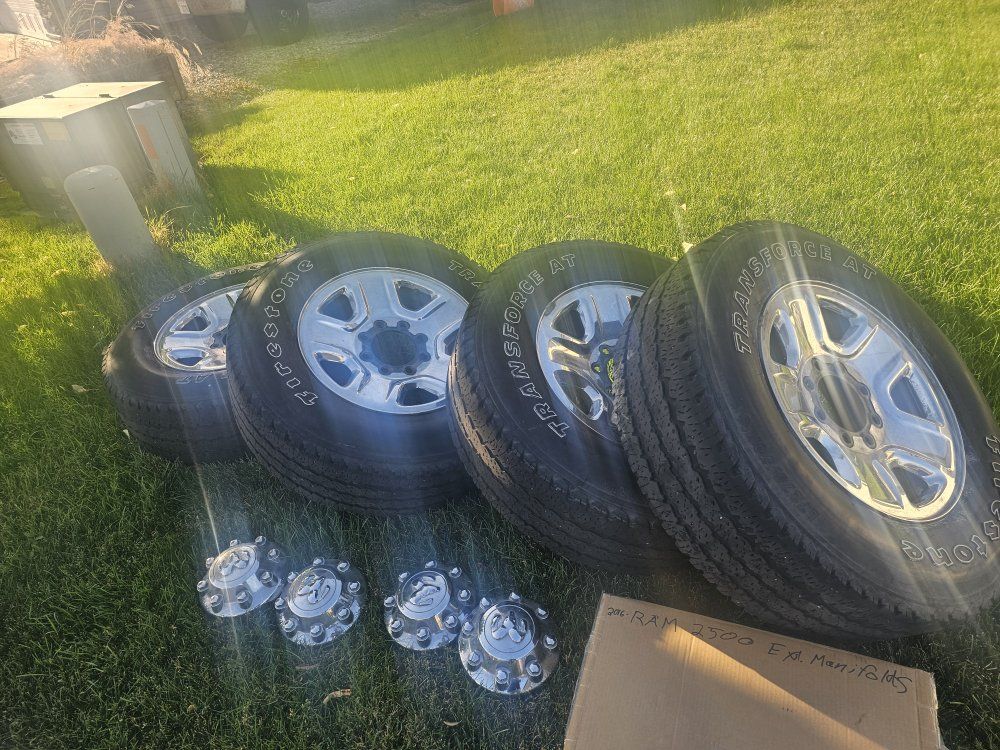 Dodge 3/4 ton 2500 factory rims wheels tires with covers.
