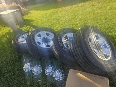 Dodge 3/4 ton 2500 factory rims wheels tires with covers.