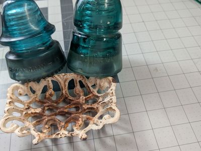Antique soap dish and glass electric insulators