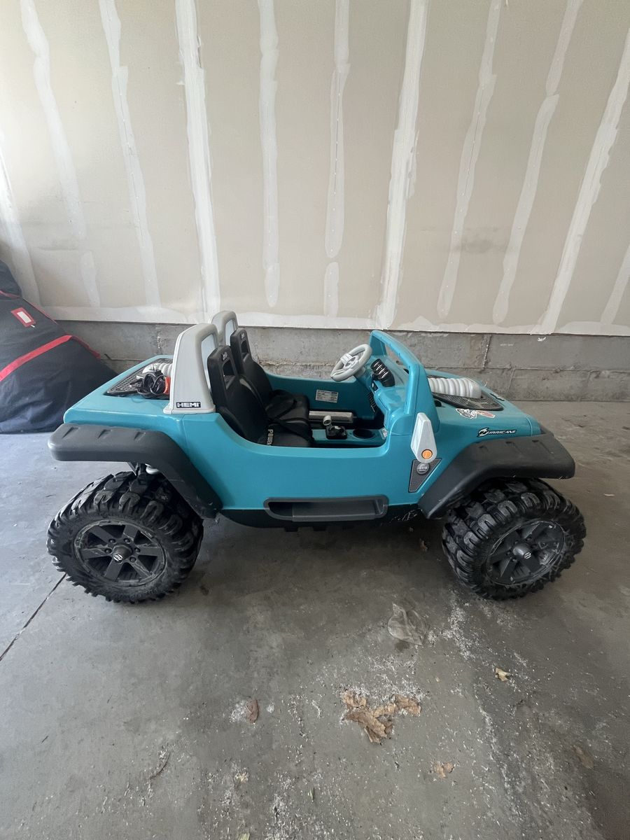 Jeep Wrangler Power Wheels Teal 12V Ride-On Toy Car for Kids