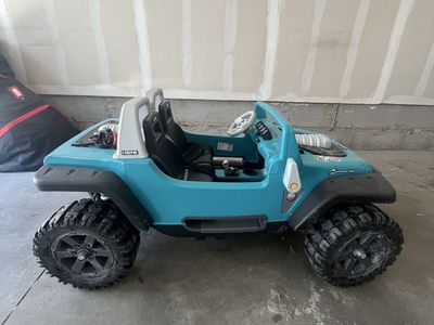 Jeep Wrangler Power Wheels Teal 12V Ride-On Toy Car for Kids