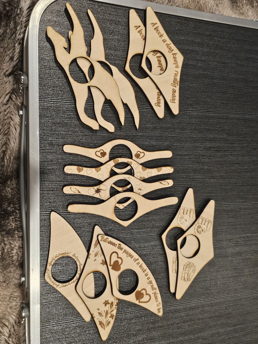 Assorted Wooden Page Holders, toothpaste rollers and dog poop sac holders