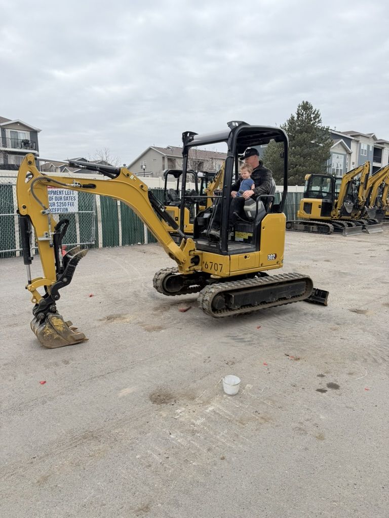 Cat 302 For Rent - 20 Class, 2 Ton Machine with Retractable Tracks. Backyard Capable