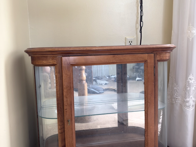 Vintage, low profile half round curio cabinet
