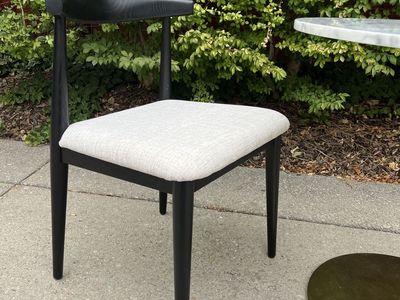 Round Marble Top Cafe Table with Brass Base and Black Accent Chair