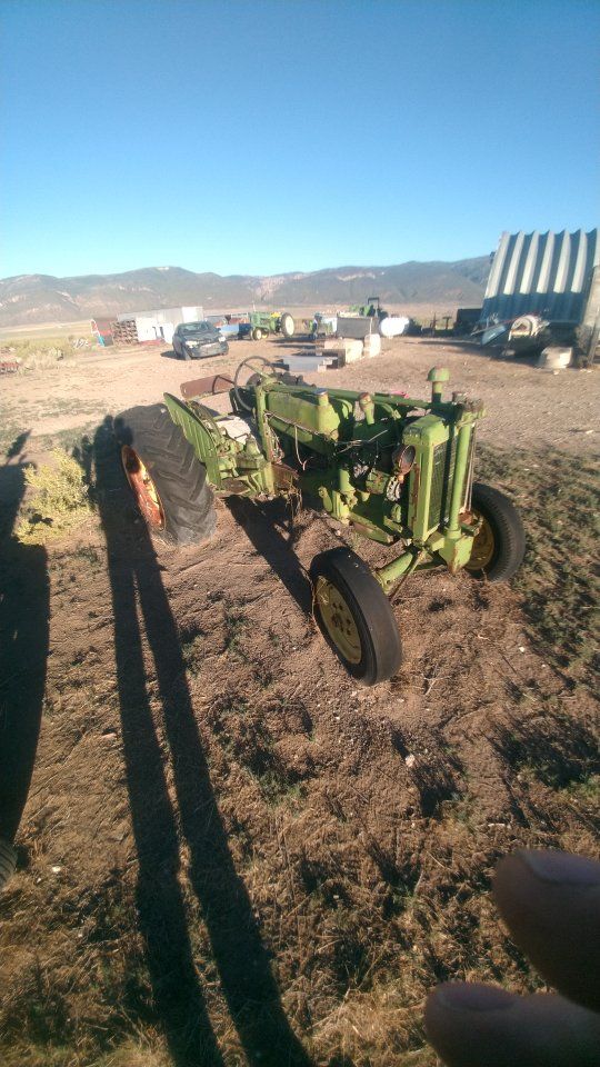 Two John Deere 40s. 1000 dollars takes both . lots of good parts. The two will make one good tractor.
