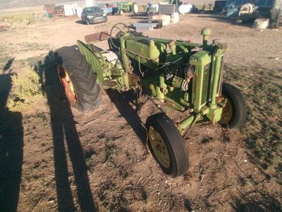 Two John Deere 40s. 1000 dollars takes both . lots of good parts. The two will make one good tractor.