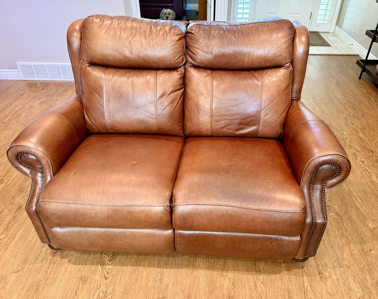 Two Genuine Leather Reclining Loveseats – Good  Condition - Must be sold as a set