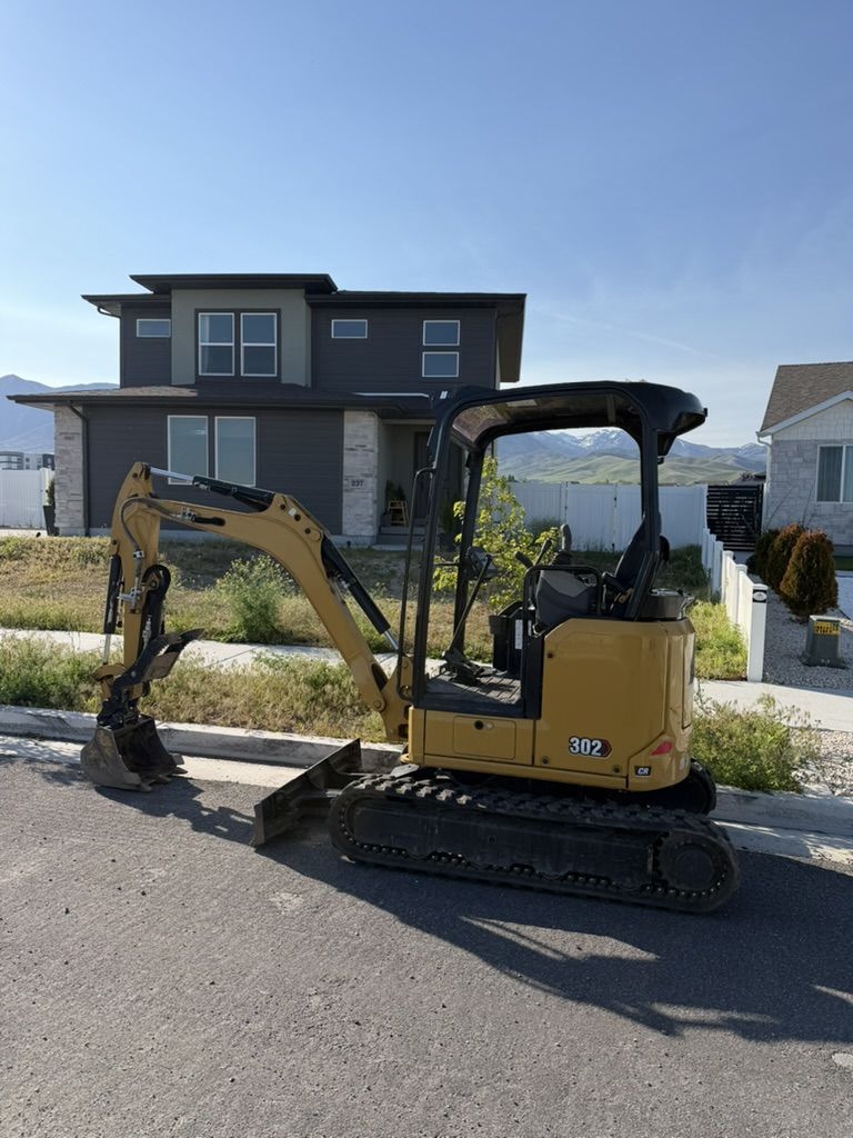Cat 302 & Cat 301.8 Mini Excavators for Rent - Compact Excavators For Backyard Access