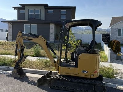 Cat 302 & Cat 301.8 Mini Excavators for Rent - Compact Excavators For Backyard Access