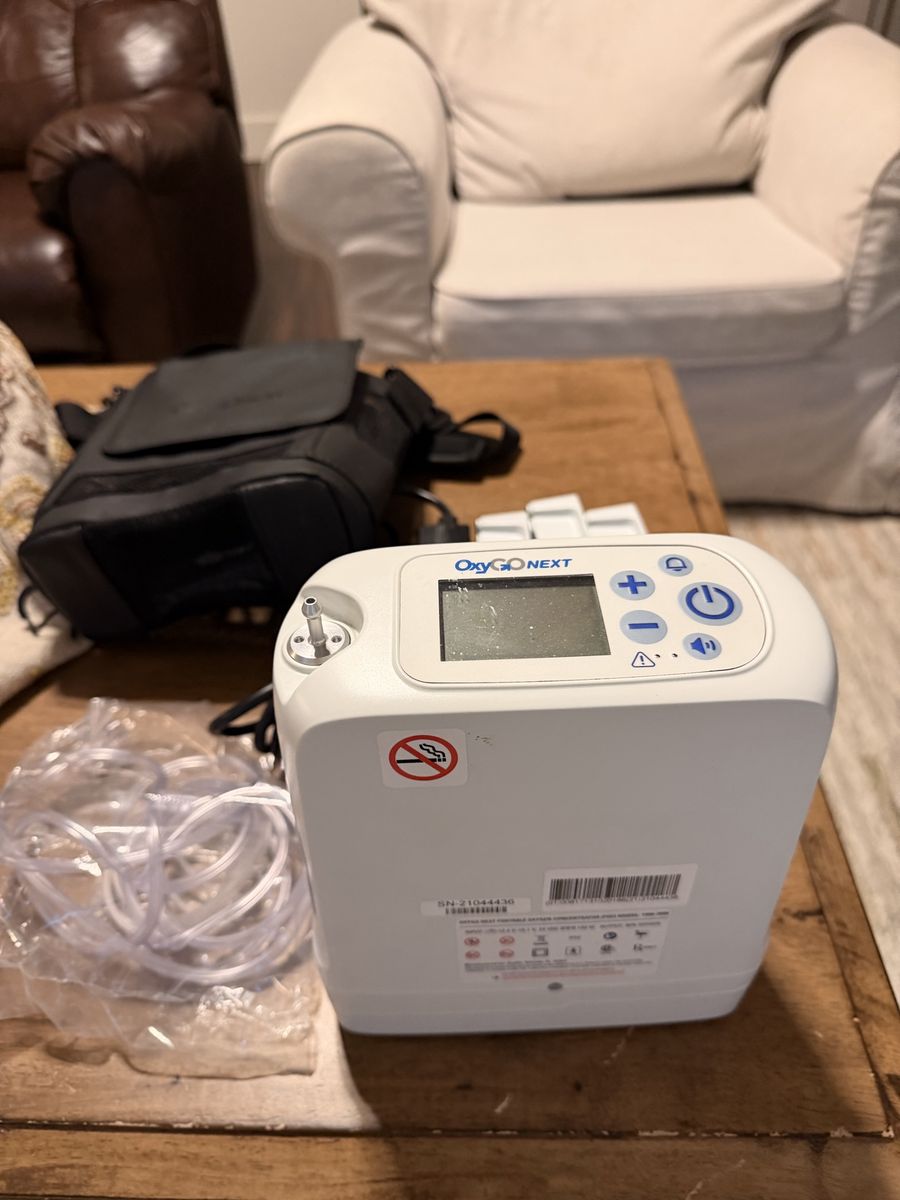 OxyGo Next Portable Oxygen Concentrator with 3 Batteries, Charger, Bag, and (Tubing new).