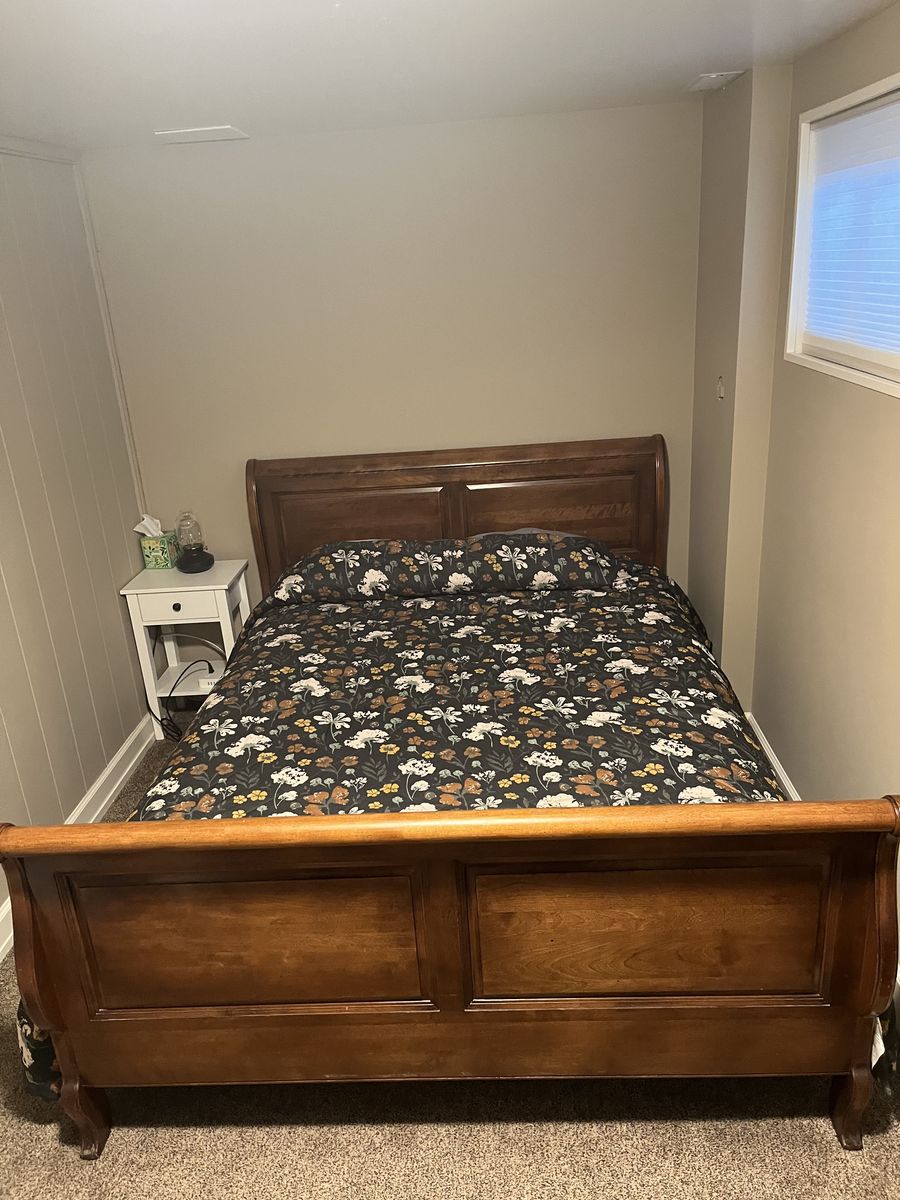 Queen Sleigh Bed and two matching night stands with drawer