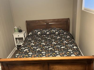 Queen Sleigh Bed and two matching night stands with drawer