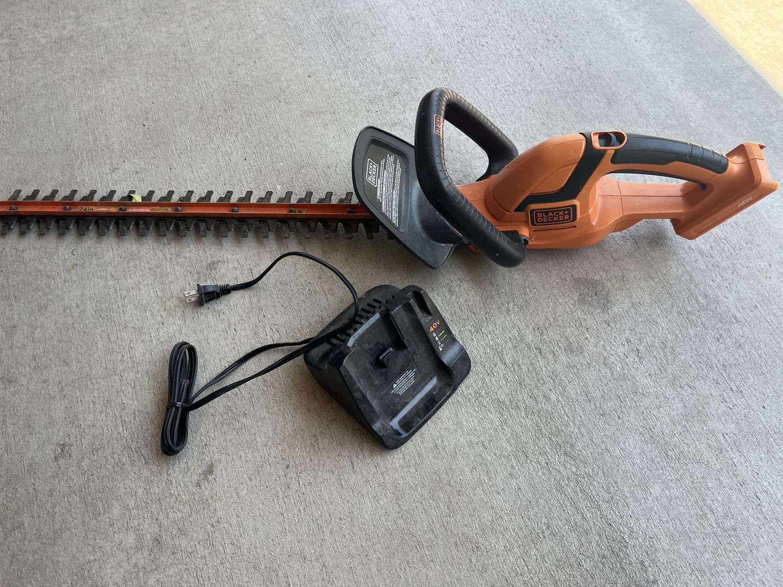 Black & Decker bush trimmer with charger. My battery died so you will need a battery but both work.