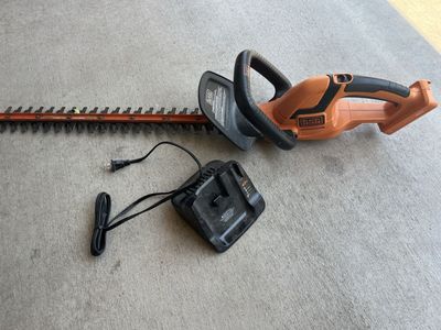 Black & Decker bush trimmer with charger. My battery died so you will need a battery but both work.