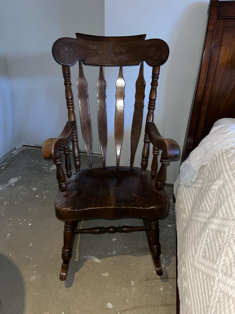 Vintage Wooden Rocking Chair with Carved Backrest and Spindle Details