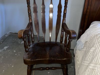 Vintage Wooden Rocking Chair with Carved Backrest and Spindle Details