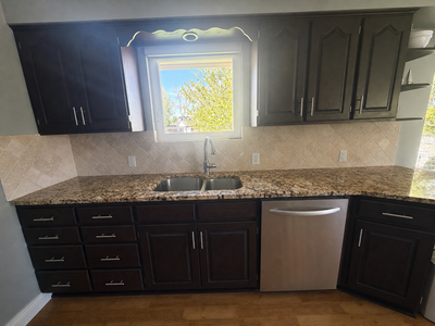 Cabinets, countertops, dishwasher, sink