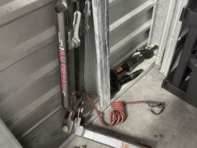 Roadmaster all-terrain towbar with receiver and safety cables.