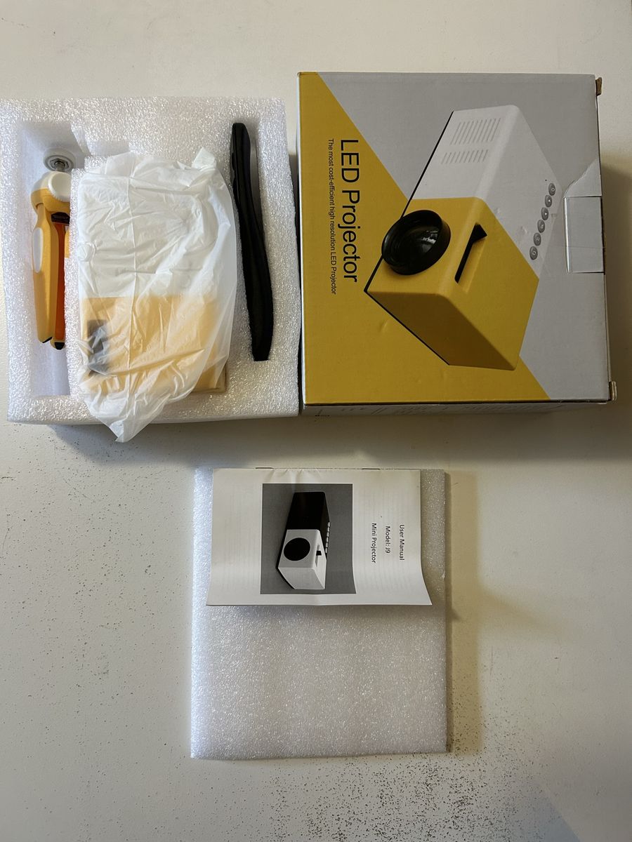 J9 Mini LED Projector Yellow and White with Accessories and Manual