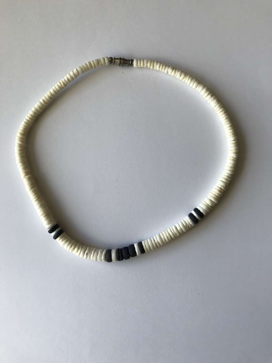 Men's white and black shell surfer necklace.