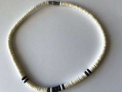 Men's white and black shell surfer necklace.