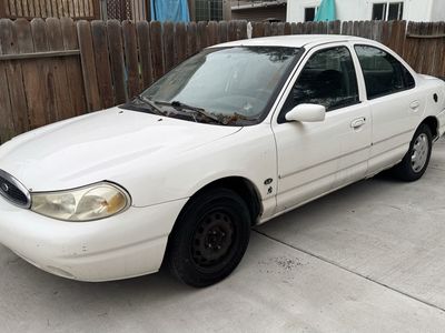 Trade 1999 Ford Contour runs and drive clean title