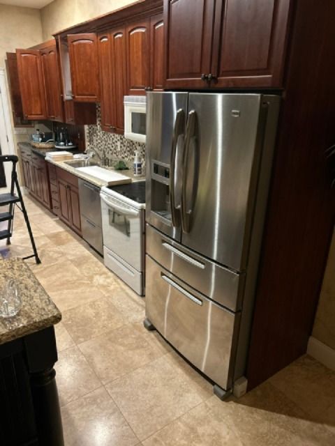 kitchen cabinets (upper and lower) with granite countertop and stainless sink/faucet