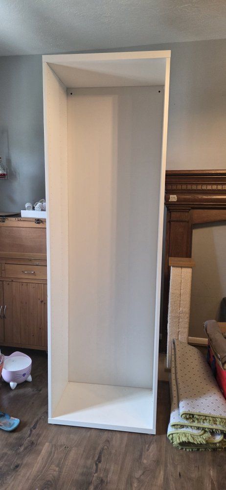 White shelving cabinet, no shelves.  6' 4" x 15 ½" x 23 ¹/²"