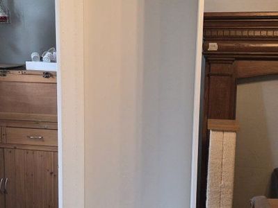 White shelving cabinet, no shelves. 6' 4" x 15 ½" x 23 ¹/²"