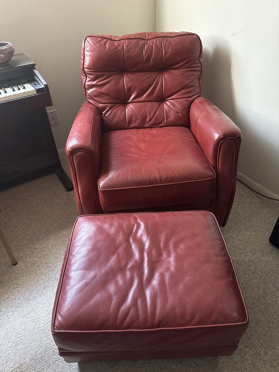 Matching set of red leather armchairs and ottomans