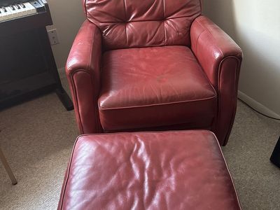 Matching set of red leather armchairs and ottomans