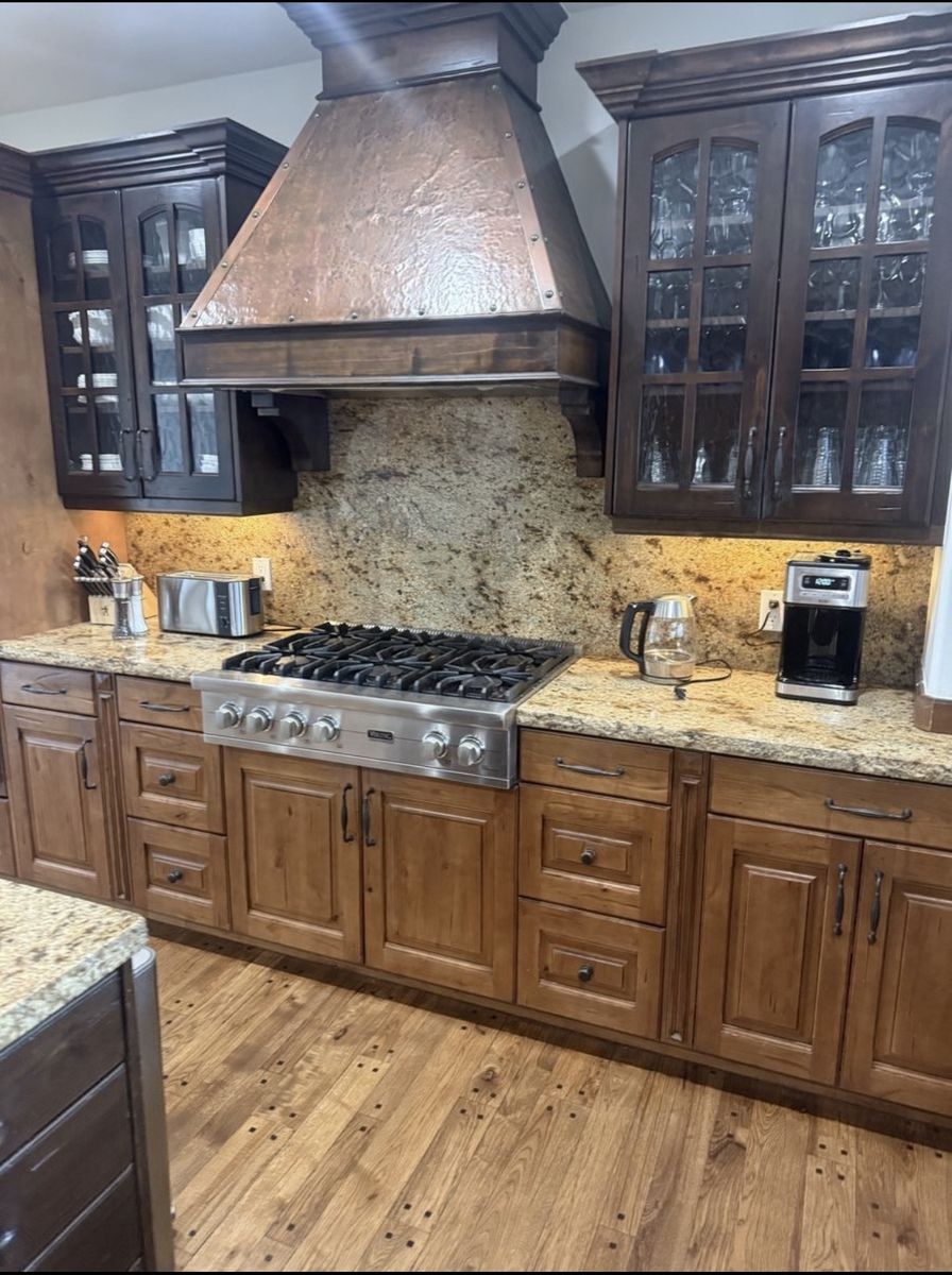 Cabinets - Custom Alderwood glass front with divided light and wavy glass plus Island base cabinets