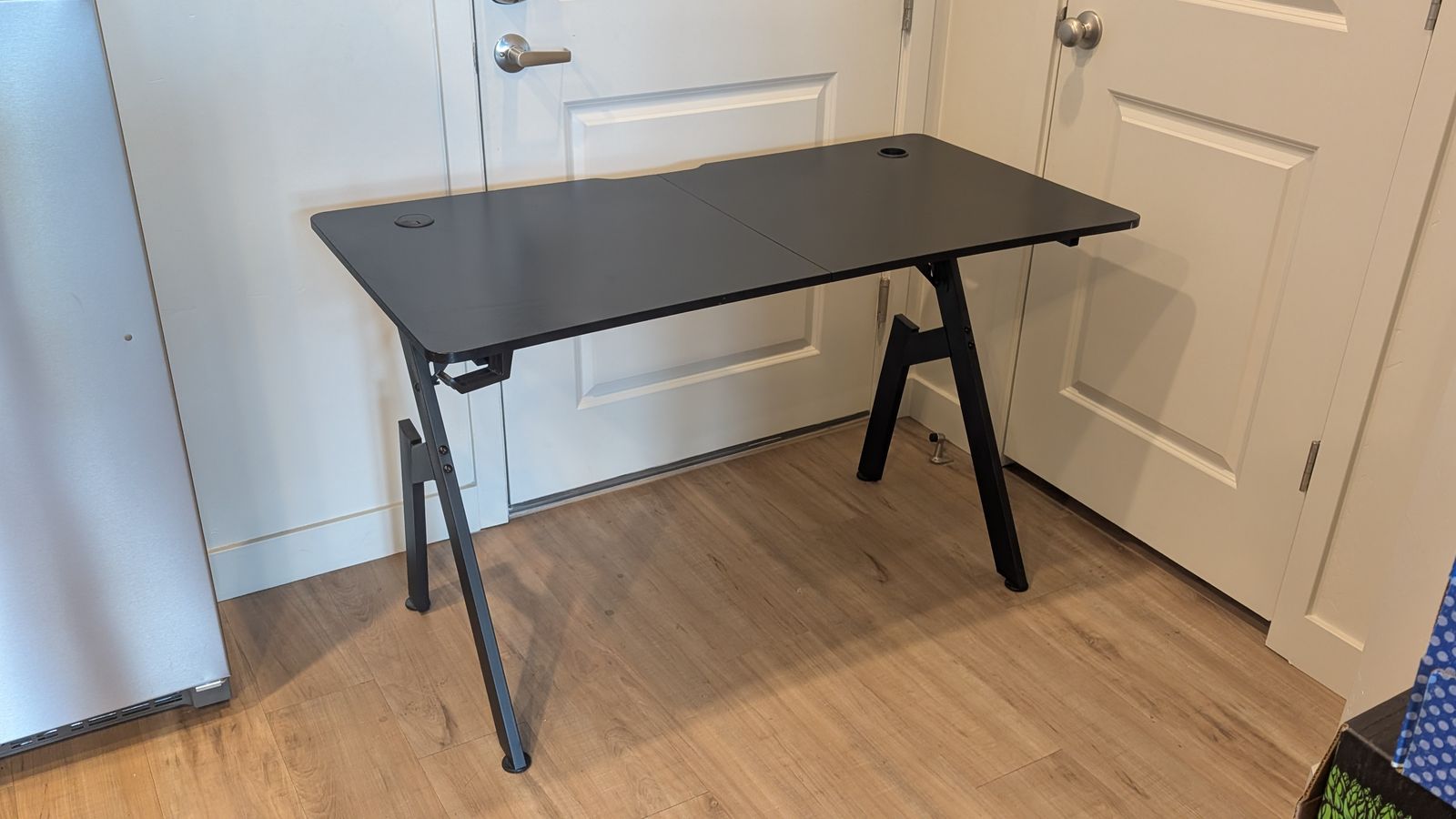 Black desk with headphone hook