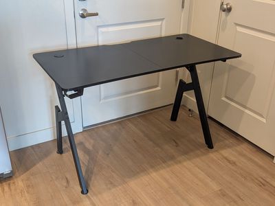 Black desk with headphone hook