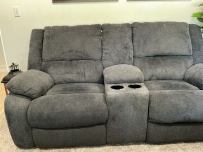 Dark blue Fabric Reclining couchewith Console and Cupholders - Used