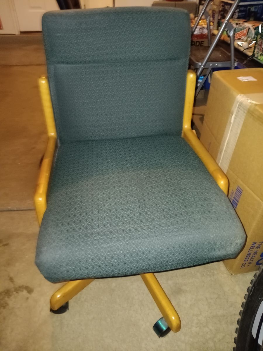 Rolling green office chair with a wood frame