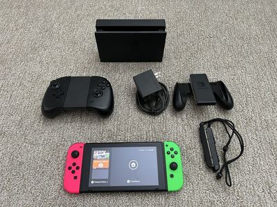 Nintendo Switch Console with Neon Joy-Cons, Dock, AC Adapter, and Grips - Excellent Condition