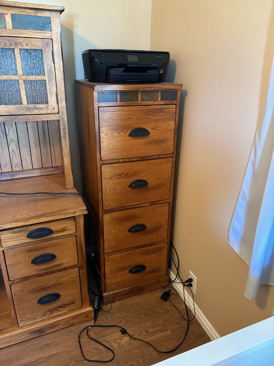 Solid oak filing cabinet.