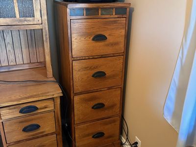 Solid oak filing cabinet.