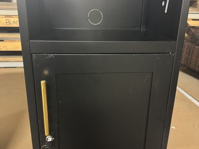 Steel cabinet with locking door.